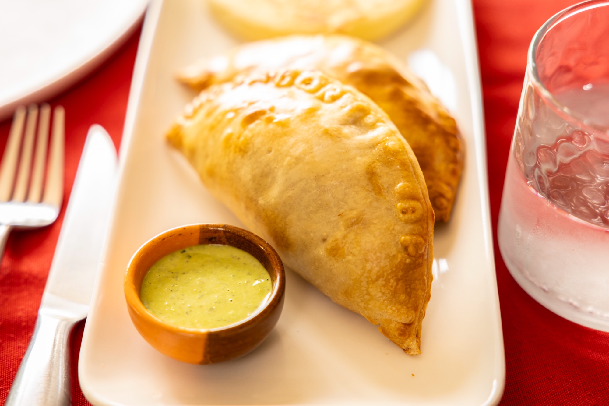 Crisp empanada with dipping sauce